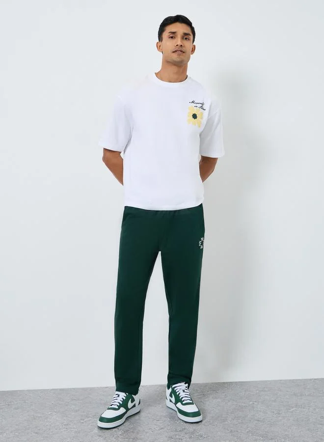 Men Green Slim Fit Embroidered Joggers